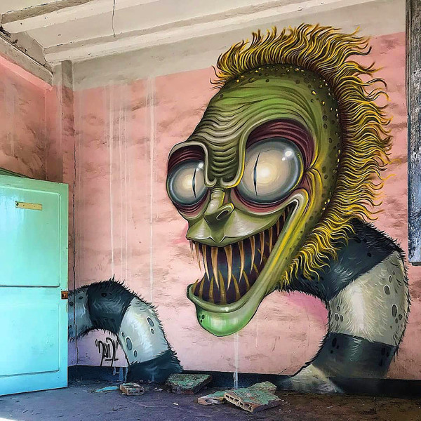 Barcelona street artist, David L, and his graffiti rendering of actor Micheal as Beetlejuice.