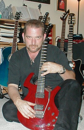 Craig with red guitar